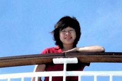 onboard a cruise in the open sea, facing strong wind head on